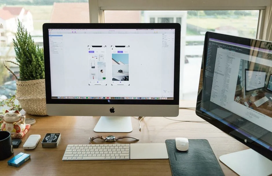 A contemporary workspace showcasing a laptop, tablet, and smartphones, ideal for tech and freelance use.
